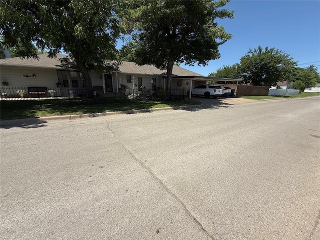 ranch-style house with an attached carport