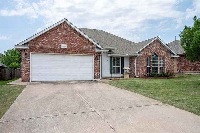 11014 Madison Ave, Midwest City, OK 73130 - view of front facade with brick siding, concrete driveway, an attached garage, and a shingled roof