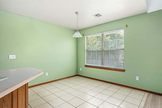 11014 Madison Ave, Midwest City, OK 73130 - unfurnished dining area with baseboards
