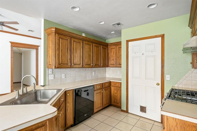 11014 Madison Ave, Midwest City, OK 73130 - kitchen featuring dishwasher, a sink, tasteful backsplash, brown cabinetry, and a ceiling fan