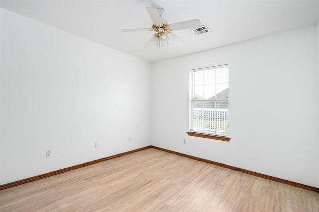 11014 Madison Ave, Midwest City, OK 73130 - unfurnished room with light wood-style floors, baseboards, and a ceiling fan