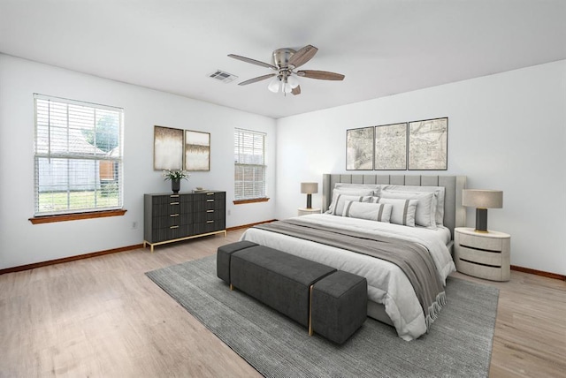 11014 Madison Ave, Midwest City, OK 73130 - bedroom with wood finished floors, baseboards, and ceiling fan