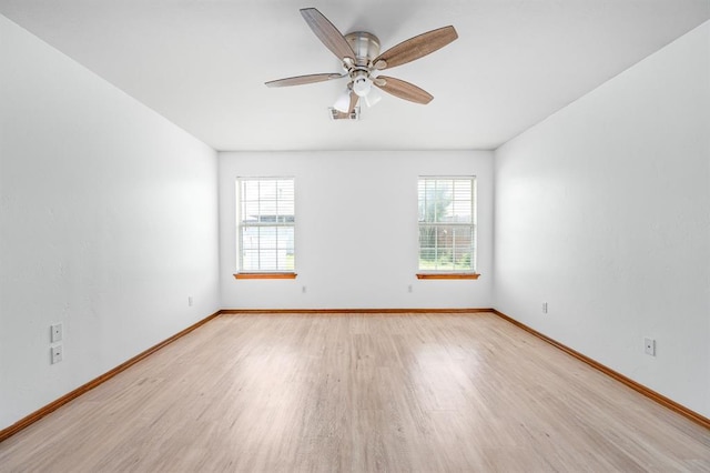 11014 Madison Ave, Midwest City, OK 73130 - unfurnished room with light wood-type flooring, a ceiling fan, and baseboards