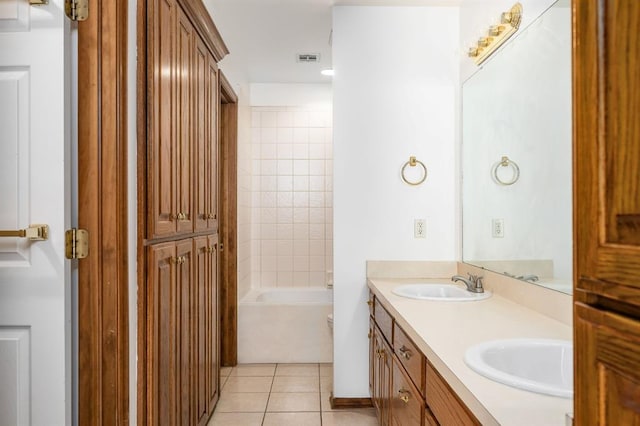 11014 Madison Ave, Midwest City, OK 73130 - full bath featuring double vanity, tile patterned flooring, toilet, and tub / shower combination