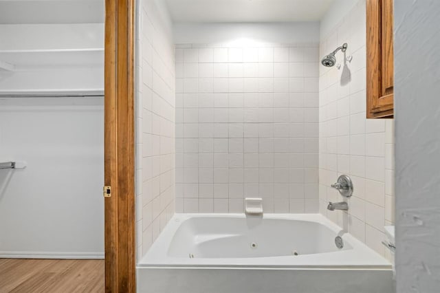 11014 Madison Ave, Midwest City, OK 73130 - bathroom with wood finished floors and a combined bath / shower with jetted tub
