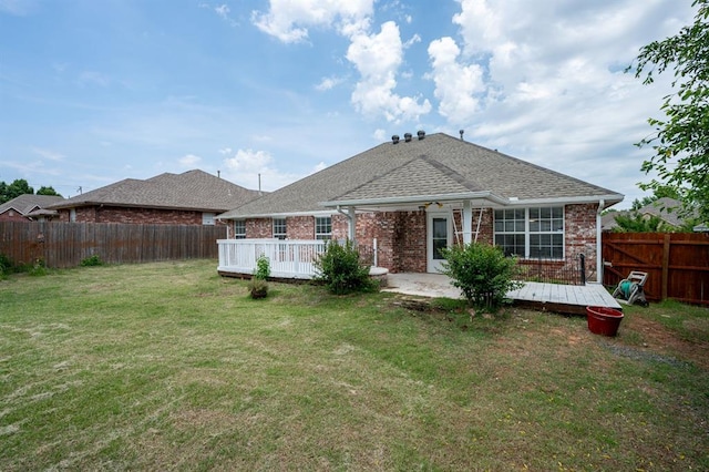 11014 Madison Ave, Midwest City, OK 73130 - rear view of house featuring brick siding, a deck, and roof with shingles