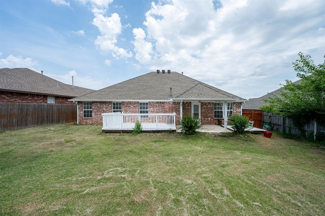 11014 Madison Ave, Midwest City, OK 73130 - rear view of house featuring brick siding, a deck, and a patio area