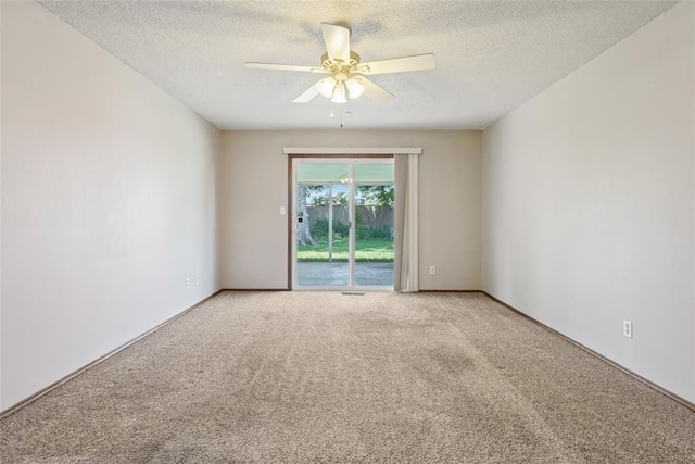 1313 SW 69th St, Oklahoma City, OK 73159 - unfurnished room featuring a ceiling fan, a textured ceiling, and light colored carpet