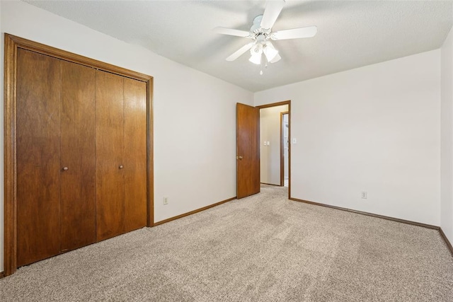 1313 SW 69th St, Oklahoma City, OK 73159 - unfurnished bedroom featuring light colored carpet, baseboards, a closet, and a ceiling fan