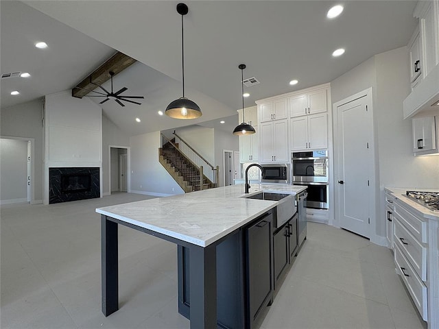 7217 NW 154th St, Edmond, OK 73013 - kitchen featuring appliances with stainless steel finishes, white cabinetry, a sink, a ceiling fan, and recessed lighting