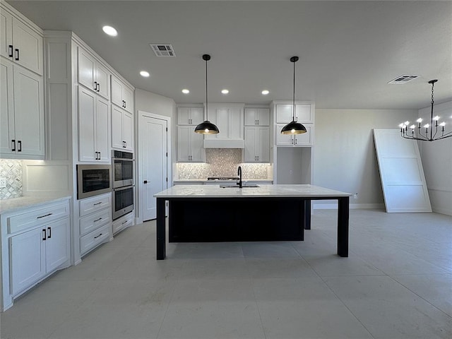 7217 NW 154th St, Edmond, OK 73013 - kitchen with stainless steel double oven, backsplash, white cabinets, a chandelier, and recessed lighting