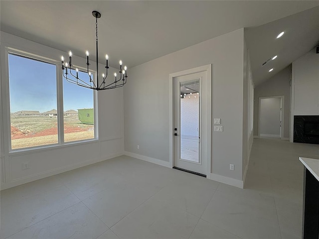 7217 NW 154th St, Edmond, OK 73013 - unfurnished dining area with a chandelier, light tile patterned floors, and baseboards