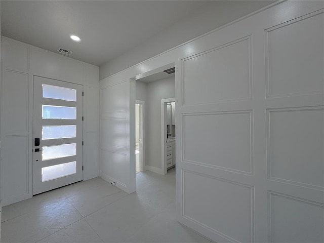 7217 NW 154th St, Edmond, OK 73013 - foyer with light tile patterned floors and recessed lighting