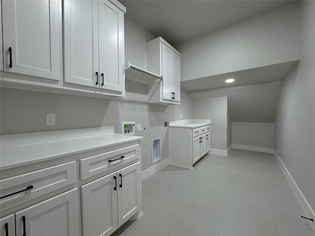 7217 NW 154th St, Edmond, OK 73013 - washroom featuring cabinet space, washer hookup, hookup for an electric dryer, and baseboards
