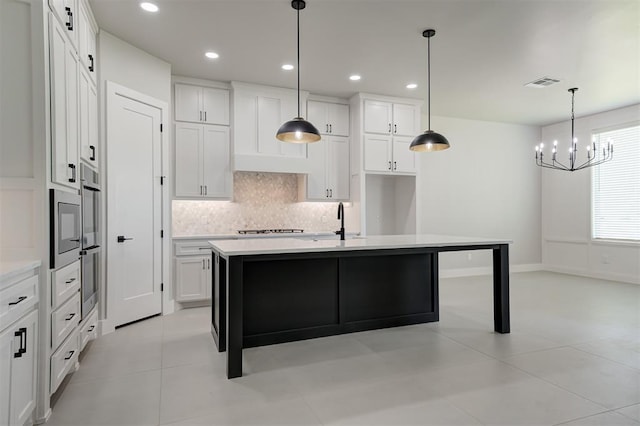 7217 NW 154th St, Edmond, OK 73013 - kitchen featuring decorative backsplash, light countertops, white cabinetry, a chandelier, and recessed lighting