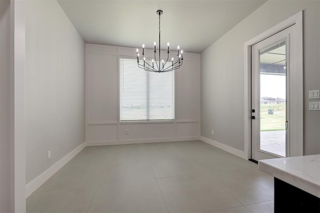7217 NW 154th St, Edmond, OK 73013 - unfurnished dining area featuring a chandelier and light tile patterned flooring