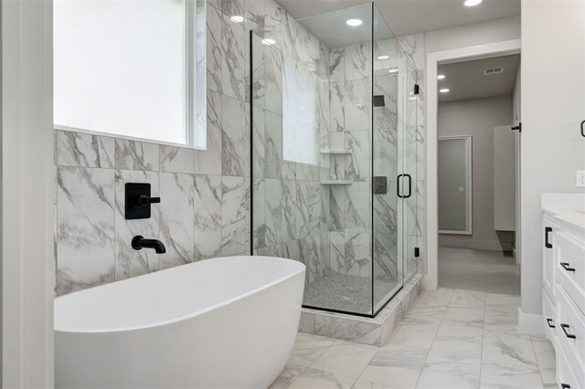 7217 NW 154th St, Edmond, OK 73013 - full bathroom featuring a freestanding bath, vanity, marble finish flooring, a marble finish shower, and recessed lighting