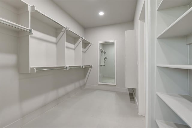 7217 NW 154th St, Edmond, OK 73013 - walk in closet featuring tile patterned floors