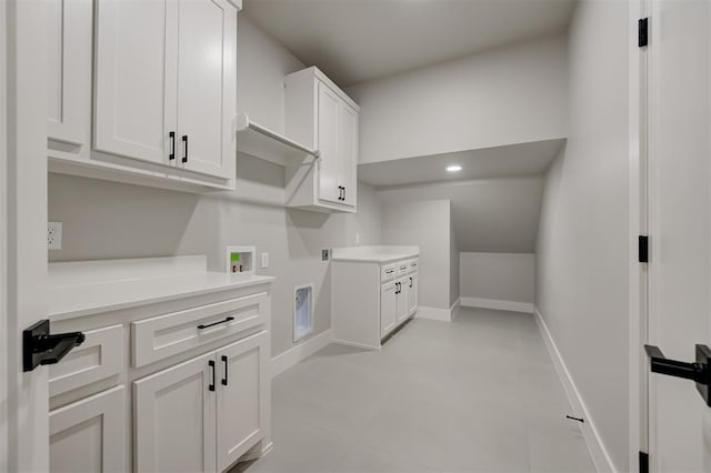 7217 NW 154th St, Edmond, OK 73013 - laundry area featuring electric dryer hookup, cabinet space, and washer hookup