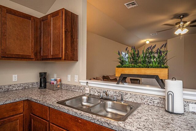 1701 Cambridge Row, The Village, OK 73120 - kitchen featuring vaulted ceiling, a sink, and a ceiling fan