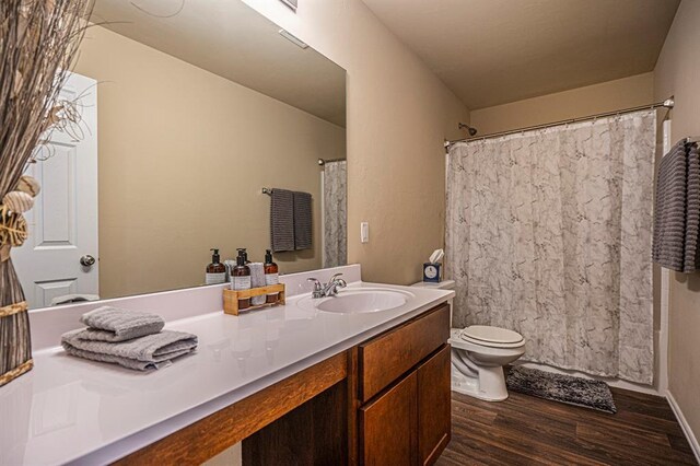 1701 Cambridge Row, The Village, OK 73120 - bathroom featuring wood finished floors, vanity, toilet, and a shower with curtain