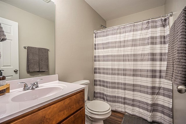 1701 Cambridge Row, The Village, OK 73120 - full bathroom featuring toilet, vanity, wood finished floors, and a shower with shower curtain