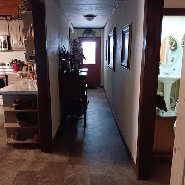 300 Bayberry Rd, Broken Bow, OK 74728 - hallway with baseboards and a sink
