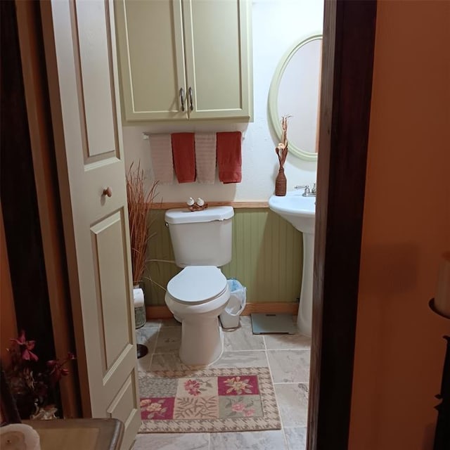 300 Bayberry Rd, Broken Bow, OK 74728 - bathroom with a wainscoted wall and toilet