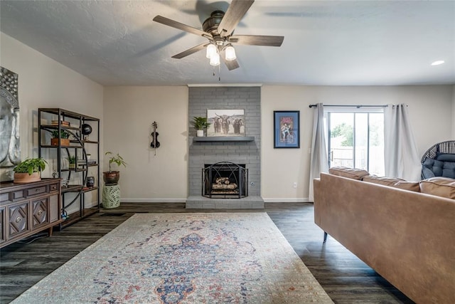 2416 Northwood Ln, Edmond, OK 73013 - living area with ceiling fan, dark wood-type flooring, baseboards, a fireplace, and recessed lighting