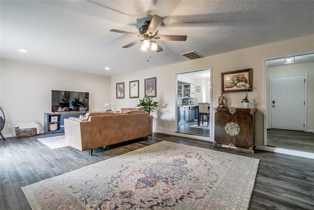2416 Northwood Ln, Edmond, OK 73013 - living area with wood finished floors, a ceiling fan, baseboards, and recessed lighting