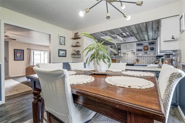 2416 Northwood Ln, Edmond, OK 73013 - dining area featuring a chandelier and dark wood-type flooring