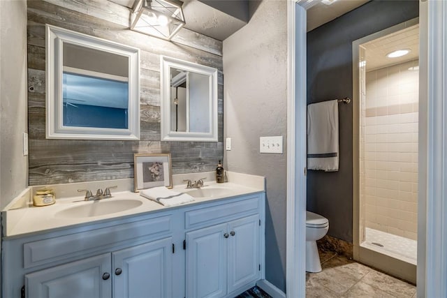 2416 Northwood Ln, Edmond, OK 73013 - full bathroom with double vanity, toilet, and a shower stall