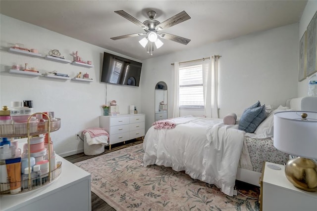 2416 Northwood Ln, Edmond, OK 73013 - bedroom featuring wood finished floors, baseboards, and ceiling fan