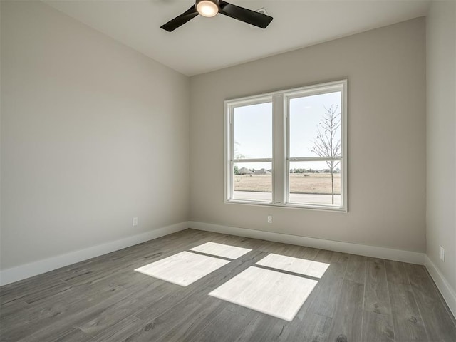 6305 NW 153rd St, Edmond, OK 73013 - unfurnished room featuring wood finished floors and a ceiling fan