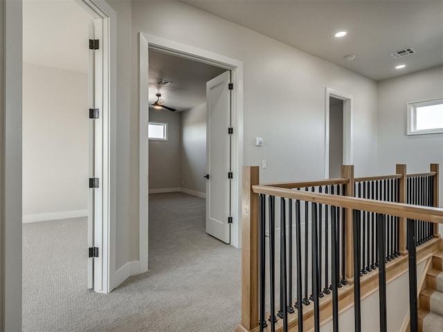 6305 NW 153rd St, Edmond, OK 73013 - hall featuring light colored carpet, an upstairs landing, and recessed lighting