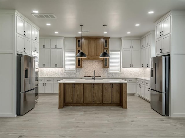 6305 NW 153rd St, Edmond, OK 73013 - kitchen with stainless steel fridge with ice dispenser, light countertops, white cabinets, and recessed lighting