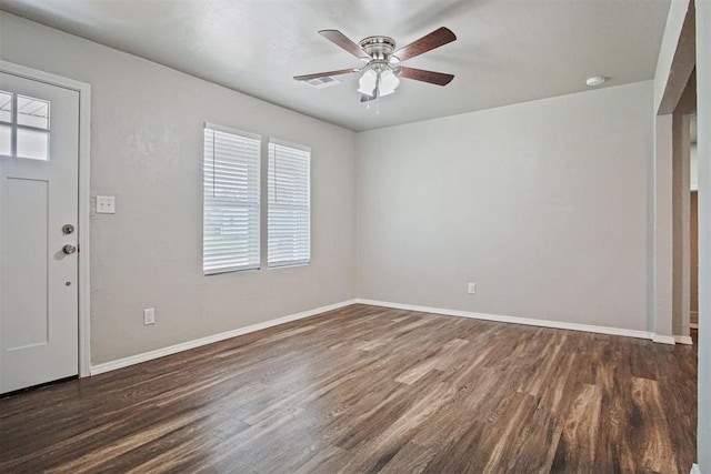 417 Russell Dr, Midwest City, OK 73110 - foyer featuring healthy amount of natural light, dark wood-type flooring, a ceiling fan, and baseboards
