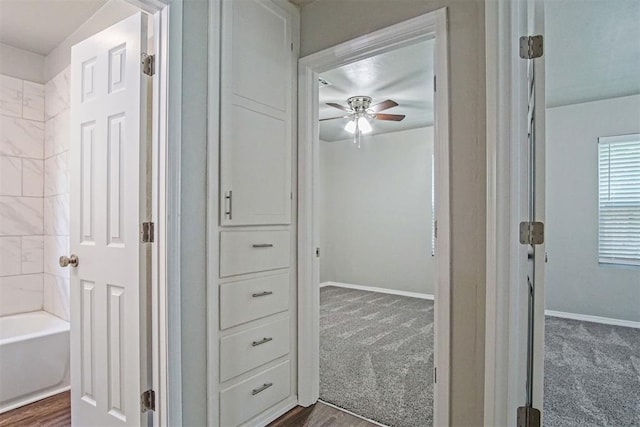 417 Russell Dr, Midwest City, OK 73110 - hall featuring dark carpet and baseboards
