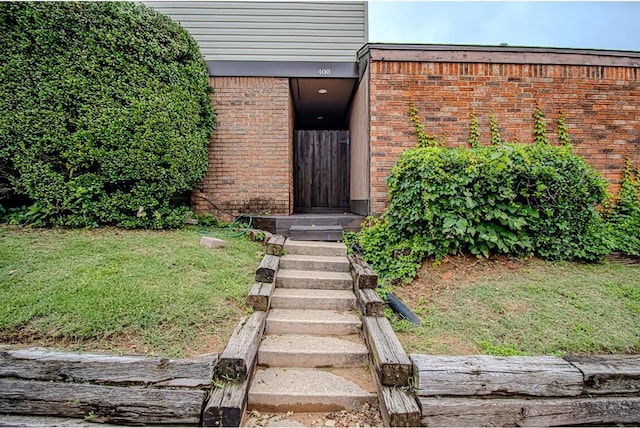 400 Timberwind Rd, Edmond, OK 73034 - entrance to property featuring brick siding and a yard
