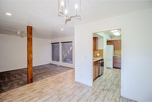 400 Timberwind Rd, Edmond, OK 73034 - kitchen featuring light wood-type flooring, freestanding refrigerator, stainless steel dishwasher, brown cabinetry, and recessed lighting