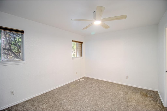 400 Timberwind Rd, Edmond, OK 73034 - carpeted empty room with baseboards and a ceiling fan