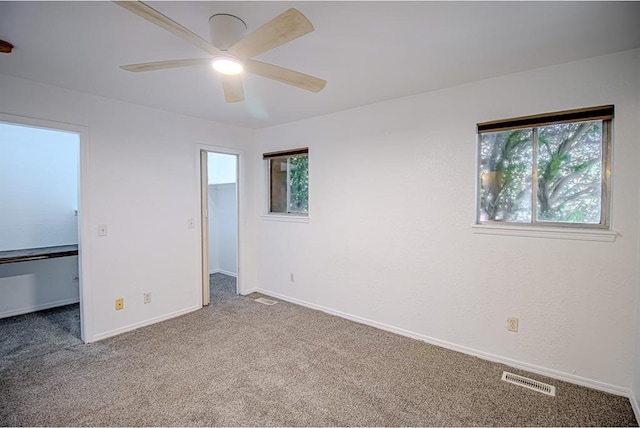 400 Timberwind Rd, Edmond, OK 73034 - unfurnished bedroom with a spacious closet, carpet floors, a closet, and baseboards