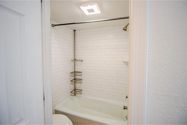 400 Timberwind Rd, Edmond, OK 73034 - full bath featuring toilet, a textured wall, and shower / tub combination