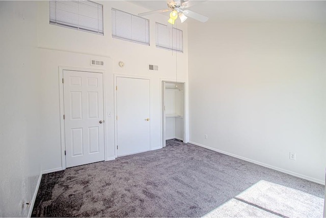 400 Timberwind Rd, Edmond, OK 73034 - unfurnished bedroom with a high ceiling, carpet floors, baseboards, and a closet