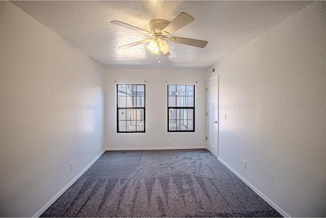 400 Timberwind Rd, Edmond, OK 73034 - carpeted empty room with ceiling fan, baseboards, and a textured wall