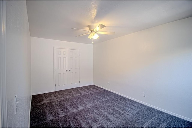 400 Timberwind Rd, Edmond, OK 73034 - carpeted empty room with a ceiling fan and baseboards