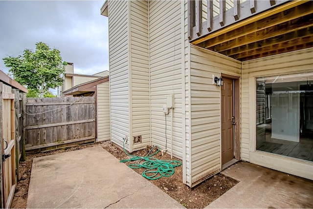 400 Timberwind Rd, Edmond, OK 73034 - property entrance with a patio and a balcony