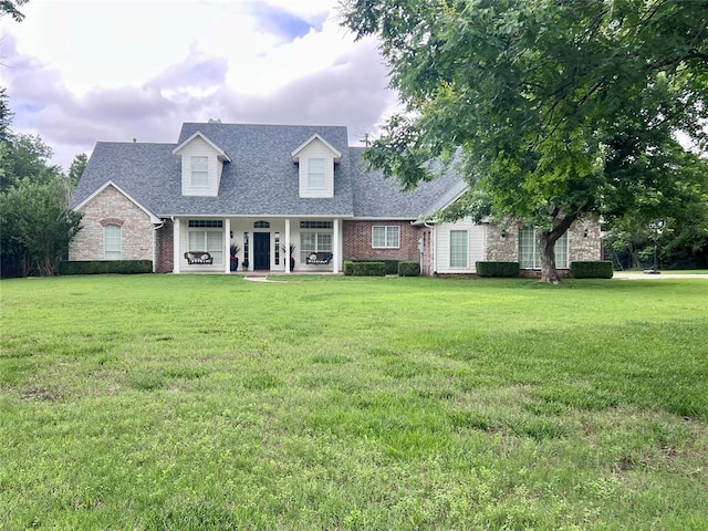 9800 Forest Glade Dr, Oklahoma City, OK 73151 - cape cod home featuring a front yard, a porch, brick siding, and a shingled roof