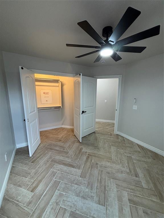 2921 Summit Crossing Pkwy, Norman, OK 73071 - spare room with a ceiling fan and baseboards