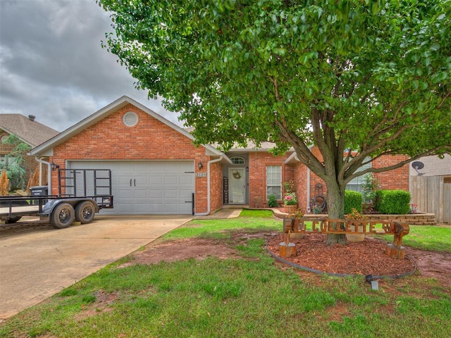 2120 NE 4th St, Moore, OK 73160 - view of front facade featuring brick siding, an attached garage, and driveway